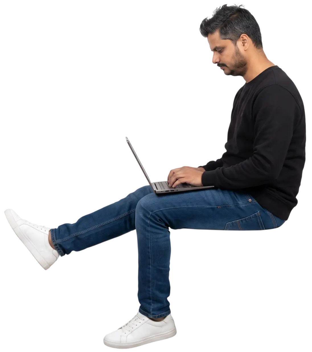 AK Dezigns web designer working on a laptop